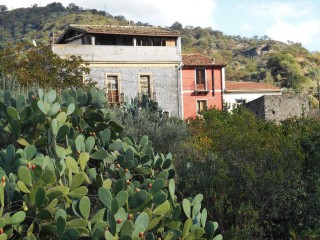 Row of old houses near my abandoned one by alcantara gorge
